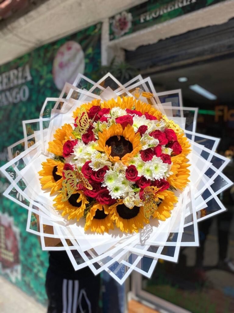 Ramo de 12 girasoles, 30 rosas rojas y follaje roxana y mariposas